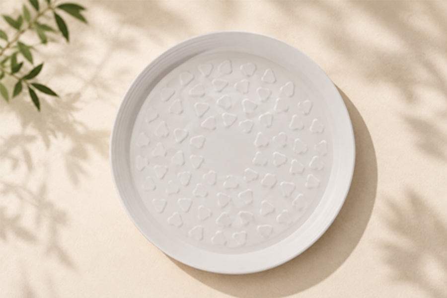 Compostable bagasse plates stacked for commercial foodservice use