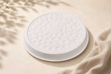 Compostable bagasse plates stacked for commercial foodservice use