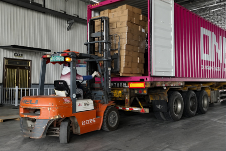 Export cartons of disposable foodservice packaging prepared for container shipment
